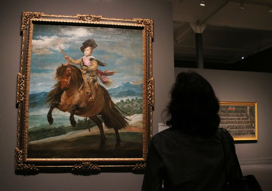 A Velázquez painting with a visitor to the CaixaForum exhibit on November 15 2018 (by Pau Cortina)